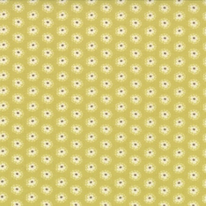 Può includere: Un tessuto giallo con un motivo ripetitivo di piccoli fiori bianchi.