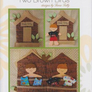 May include: A brown fabric house with two boys inside. The house has a brick exterior and a green tree growing out of the roof. The boys are wearing blue and red shirts and have brown hair. The house has two doors with the words "Kids Only" written on them.