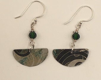 Pierced Earrings from a decorative tin