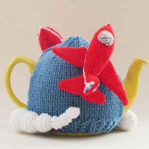 Red Arrows Tea Cosy Knitting Pattern to knit your own teapot cover with two RAF display team aircraft and their colourful jet streams