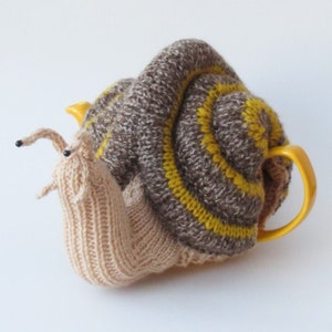 Garden Snail Tea Cosy Knitting Pattern to knit a giant snail teapot warmer - a gardeners nightmare.