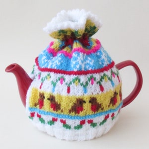 Fair Isle Jingle Bells Christmas Tea Cosy Knitting Pattern to knit this festive season inspired teapot cover complete with sleighbells