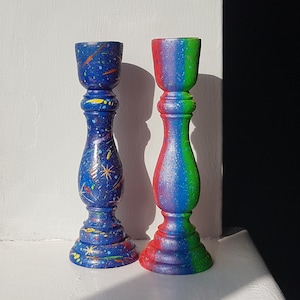 Wooden rainbow and galaxy candlestick set of 2, 16.5 cm tall, rainbow multi coloured, galaxy navy blue candle holders.