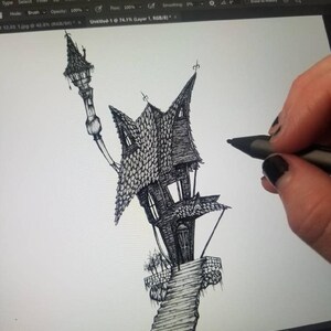 May include: A black and white illustration of a quirky, spooky house with a tall, pointed roof and a winding staircase. The drawing is being created on a digital tablet using a stylus. The house has multiple windows and a decorative lamp post.
