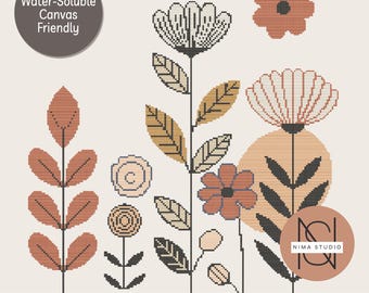 Könnte beinhalten: Ein digitales Kreuzstichmuster mit stilisierten Blumen in Rost-, Creme- und Schwarztönen. Das Design umfasst verschiedene florale Elemente, Blätter und einen kreisförmigen Hintergrund. Text enthält "Water-Soluble Canvas Friendly" und "Digital Pattern • Instant Download."