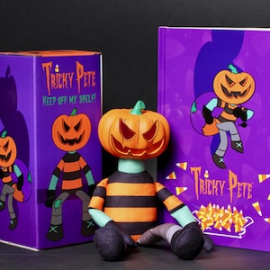 May include: A plush doll with a carved pumpkin head and a striped orange and black shirt, positioned between a purple box and a book. Both the box and the book feature the text Tricky Pete and Keep Off My Shelf with illustrations of the character.
