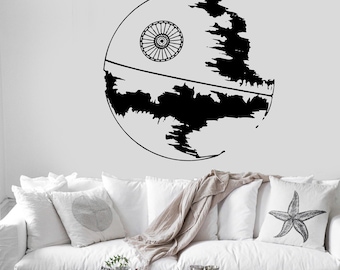 May include: A black wall decal featuring a circular space station design with a large circular dish on the upper left side and a horizontal line across the center, with jagged, irregular black shapes filling the lower half of the sphere.