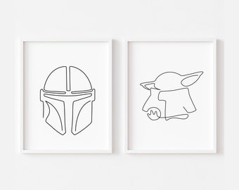 May include: Two black and white line art prints in white frames. The print on the left is a Mandalorian helmet. The print on the right is a Baby Yoda character.