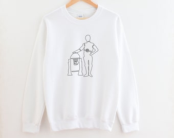 May include: White sweatshirt with a black line drawing of a character from Star Wars standing next to a robot.