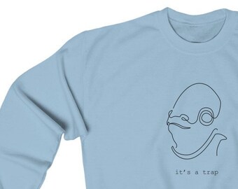 May include: Light blue sweatshirt with a line drawing of a character with the text "it's a trap" underneath.
