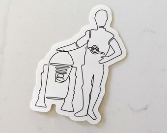 May include: A black and white line drawing of a character from Star Wars standing next to a robot. The character is holding their hand on their hip and the robot is standing next to them.