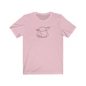 May include: A pink t-shirt with a black line drawing of a character from the Star Wars franchise, The Mandalorian.