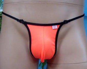 May include: Orange and black thong underwear with a small tag that says "XS".