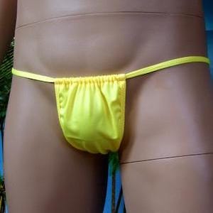 May include: A bright yellow string bikini bottom with a gathered front.