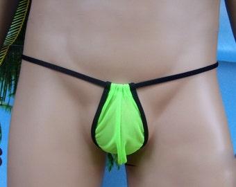 May include: Neon green thong underwear with black trim and a black string waistband. The pouch is gathered at the top and has a small tassel detail. The background is a light blue.