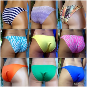 May include: Assortment of nine different colored and patterned bikini bottoms. The bottoms are all made of a smooth, stretchy fabric and have a low-rise cut. The colors include black, white, blue, green, orange, yellow, pink, and purple. The patterns include stripes, zebra print, floral print, and solid colors.