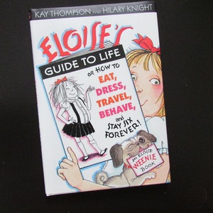 ELOISE'S GUIDE To LIFE or How To Eat, Dress, Travel, Behave, And Stay Six Forever! by Kay Thompson with original Plaza Hotel Gold Sticker