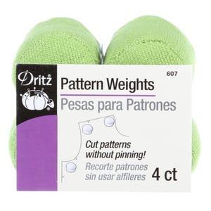 May include: Four green Dritz Pattern Weights. The package includes a white and purple label with the text "Pattern Weights" and "Cut patterns without pinning!" The weights are designed for use in sewing and crafting projects.