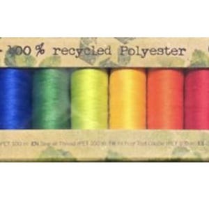 May include: A rectangular cardboard box containing ten spools of sewing thread in a rainbow gradient of colors. The packaging features the text rPET - 100% recycled Polyester and Gütermann creativ, with a graphic of a plastic bottle on the left.