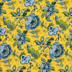 May include: A vibrant fabric featuring a repeating floral pattern. Large blue and white flowers with green leaves and stems are set against a bright yellow background. The design has a classic, botanical feel.