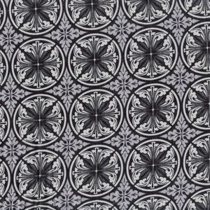 May include: A repeating pattern featuring circular and floral designs in black and white. The pattern has a vintage or antique aesthetic, with detailed, symmetrical elements. The background is a light gray color, providing contrast to the darker design.