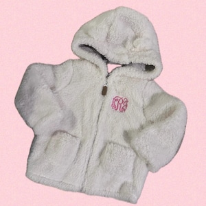 May include: White hooded fleece jacket with a zipper closure and two pockets. The jacket has a pink embroidered monogram on the front.