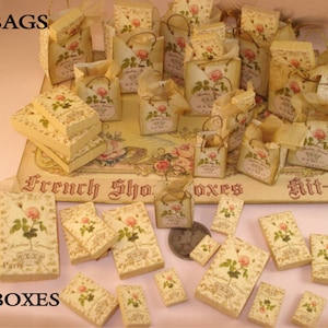 May include: A set of 12 miniature paper bags and 24 miniature boxes, all decorated with a floral design and the text "French Shop" and "Kit-30".