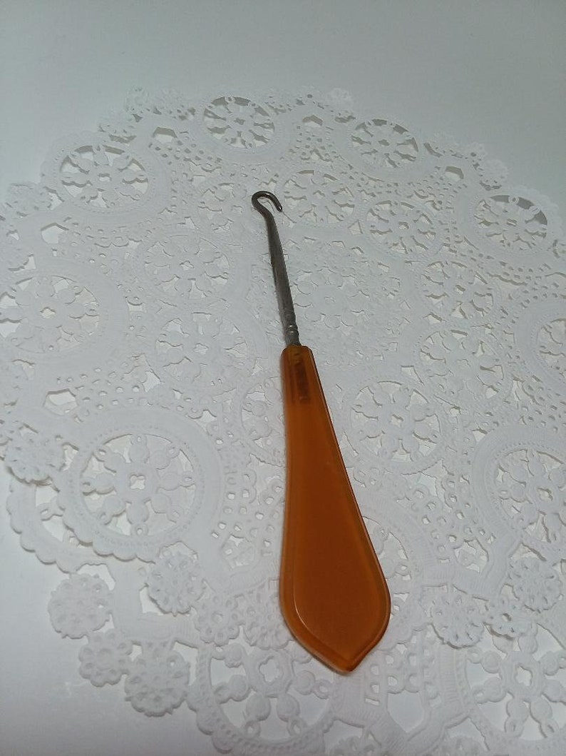 Pearl and Amber Celluloid button hook
