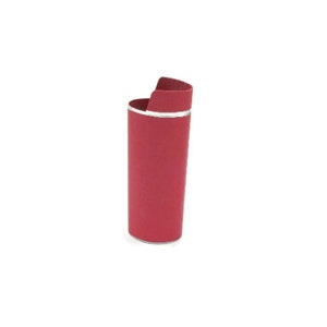 May include: A red lighter with a silver trim. The lighter is a cylinder shape with a rounded top.