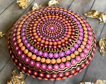 Hand-painted dot art mandala stone in pink, orange and gold