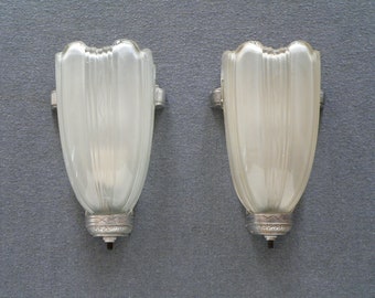 Pair of antique art deco sconces with slip shade.