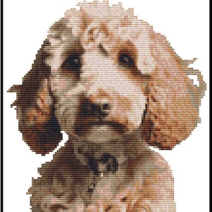 May include: A cross-stitch depiction of a dog, rendered in shades of light and dark brown. The image showcases detailed stitching to create the dog's fur, set against a white backdrop within a black frame.