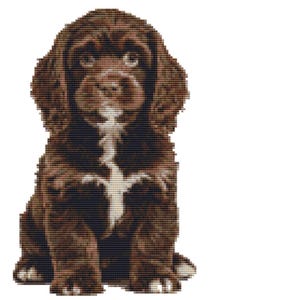 May include: A cross-stitch depiction of a puppy with brown fur and a white marking on its chest. The puppy is seated, gazing forward with a gentle expression. The background is plain white.
