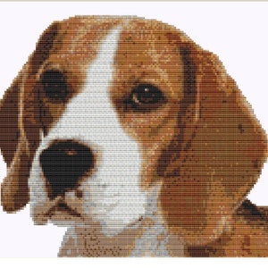 May include: A cross-stitch portrait of a Beagle dog, using brown, white, and black thread. The dog's face is in profile, with detailed stitching capturing its expressive eyes and floppy ears. The background is plain white.