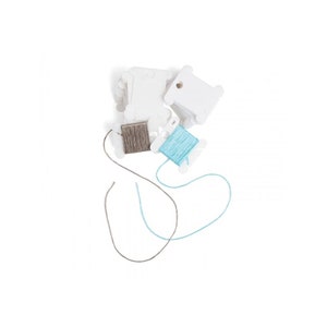 May include: Two spools of thread, one light blue and one gray, are wound around white plastic thread bobbins. The bobbins are stacked on top of each other.