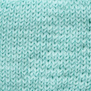 May include: Close-up of a light blue knitted fabric with a textured pattern. The fabric is soft and has a subtle sheen.