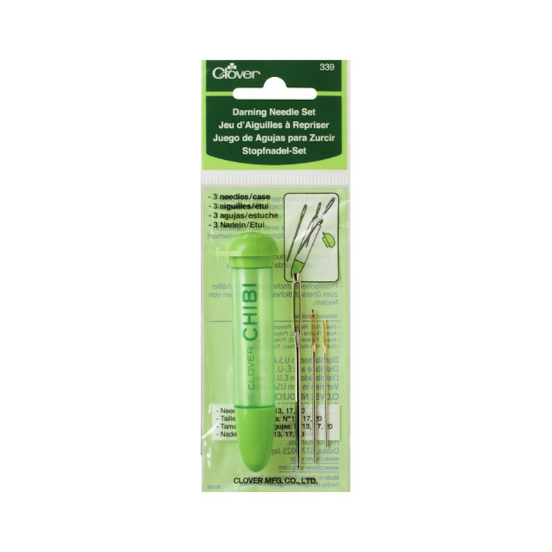 May include: A Clover Chibi darning needle set. The package includes a green plastic needle holder with the brand name and the text "Chibi". The set contains three needles of varying sizes, ideal for mending and repair work.