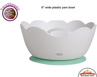 Yarn Bowl. A plastic yarn valet holds small balls of yarn and is perfect weight for your travel bag. 6" x 3" with 2 yarn holes. Lightweight