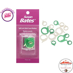 May include: A package of Susan Bates split-lock stitch count markers in a clear plastic container. The package is on a white background with several loose green and white stitch markers. The package reads "Split-Lock Stitch Count Markers".