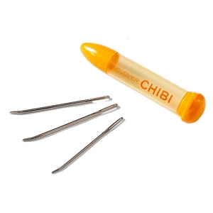 May include: A set of three Clover Chibi needles in a clear orange plastic case. The needles are silver and have a curved tip. The case has the word "Clover" and "CHIBI" printed on it.