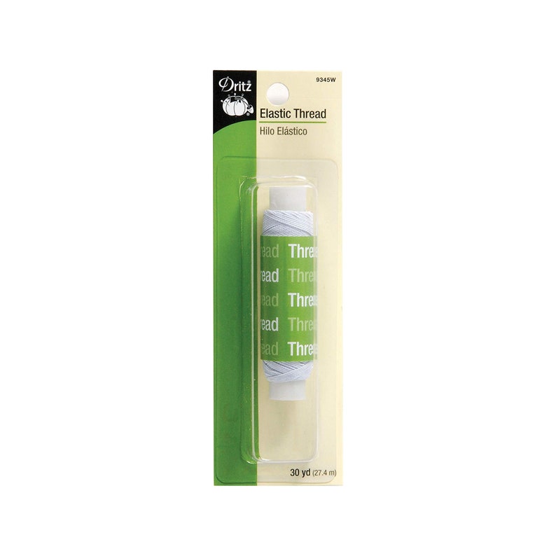 May include: A spool of white elastic thread by Dritz, packaged on a green and cream card. The label reads Elastic Thread, Hilo El&aacute;stico, and 30 yd (27.4 m). The thread is wrapped around a white plastic core, visible through a clear plastic blister.