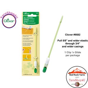 May include: A Clover #9582 Clip 'n Glide Bodkin tool for sewing projects. The tool is light green with a white and green clip. The package text reads "Pull 5/8" and wider elastic through 3/4" and wider casings."