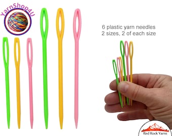 6 plastic yarn needles. 3 of each size: large and regular. Good for bulky and medium weight yarn.