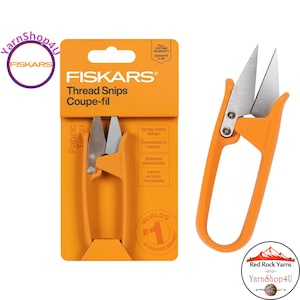 May include: Orange Fiskars thread snips with stainless steel blades. The package includes a pair of scissors and the packaging. The text on the package says "Thread Snips" and "Coupe-fil". The scissors are a spring action design.