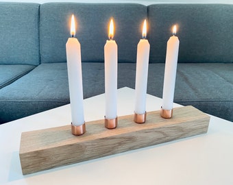 modern minimalist candle holder made of oak and copper plus table candles in white optional with fir solid oak wood
