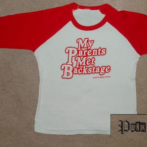 My Parents Met Backstage hand screen printed, red/white, kids baseball tee for Rolling Stone toddlers