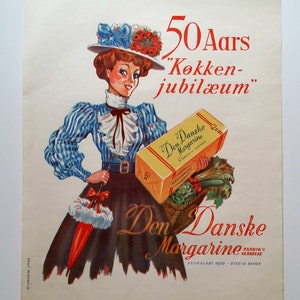 May include: A vintage advertisement for Den Danske Margarine, featuring a woman in a blue and white striped dress and a red hat holding a box of margarine. The text reads "50 Aars K&oslash;kken-jubil&aelig;um" and "Den Danske Margarine".