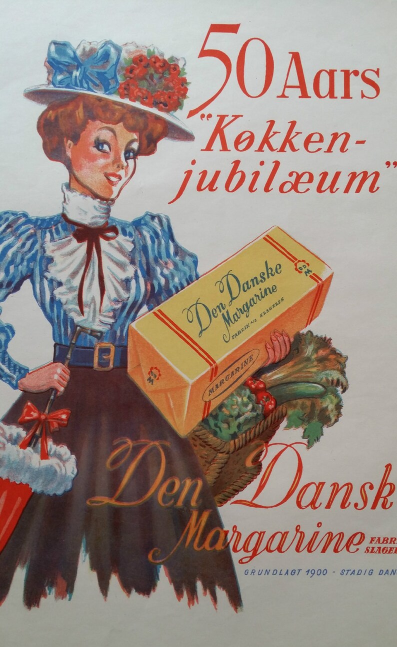 May include: A woman in a blue and white striped dress holds a box of Den Danske Margarine. The box is yellow with red and white stripes. The text on the box reads "Den Danske Margarine" and "Fabrik i Slagelse". The woman is wearing a blue hat with red flowers and a red bow. The text "50 Aars "Kokken-jubil&aelig;um" is printed in red at the top of the image. The text "Den Dansk Margarine" is printed in red at the bottom of the image. The text "Grundlagt 1900 - Stadig Dan" is printed in black at the bottom of the image.
