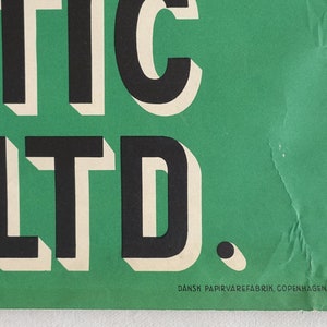May include: A green poster with the text "MATIC LTD." in black and white lettering. The text "DANSK PAPIRVAREFABRIK, COPENHAGEN DENMARK" is printed in black at the bottom of the poster.