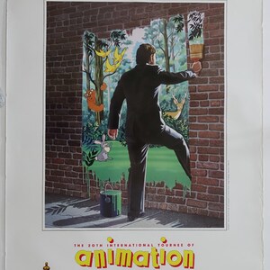 May include: A poster advertising the 20th International Tournee of Animation. The poster features a man painting a brick wall green, revealing a forest scene with animals. The text on the poster reads "The 20th International Tournee of Animation" and "An Expanded Entertainment Release".